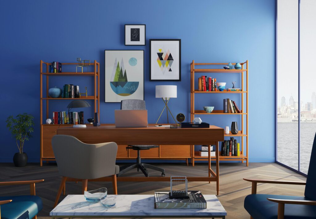Elegantly decorated home office with modern furniture and a blue wall barang jasa berkualitas